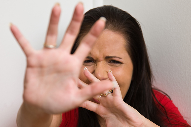 Timid woman symbol of violence in the family